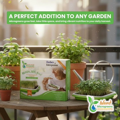 Forbes and Entrepreneur Island microgreens kit with potted plants on a table outdoors.