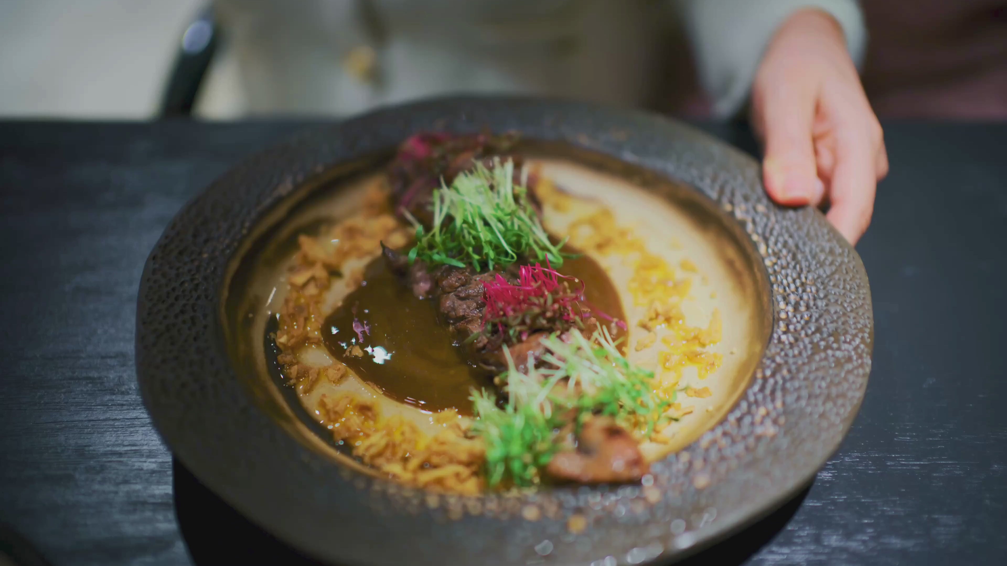 Lamb dish with microgreens on top